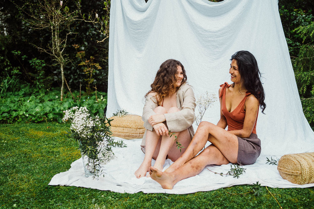 Solpardus collection shot in natural setting with flowers. Saba linen shirt Atti linen shorts Thea bamboo onepiece. All natural ethical sustainable sunwear swimwear linen clothing perfect for sensitive skin psoriasis and eczema